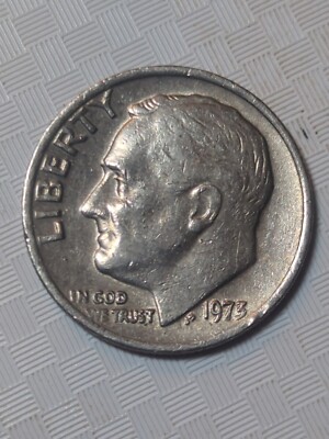 1973 Roosevelt dime missing clad layer error showing exposed copper core on one side
