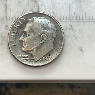1973 Roosevelt dime doubled die obverse error showing doubled lettering and date under magnification