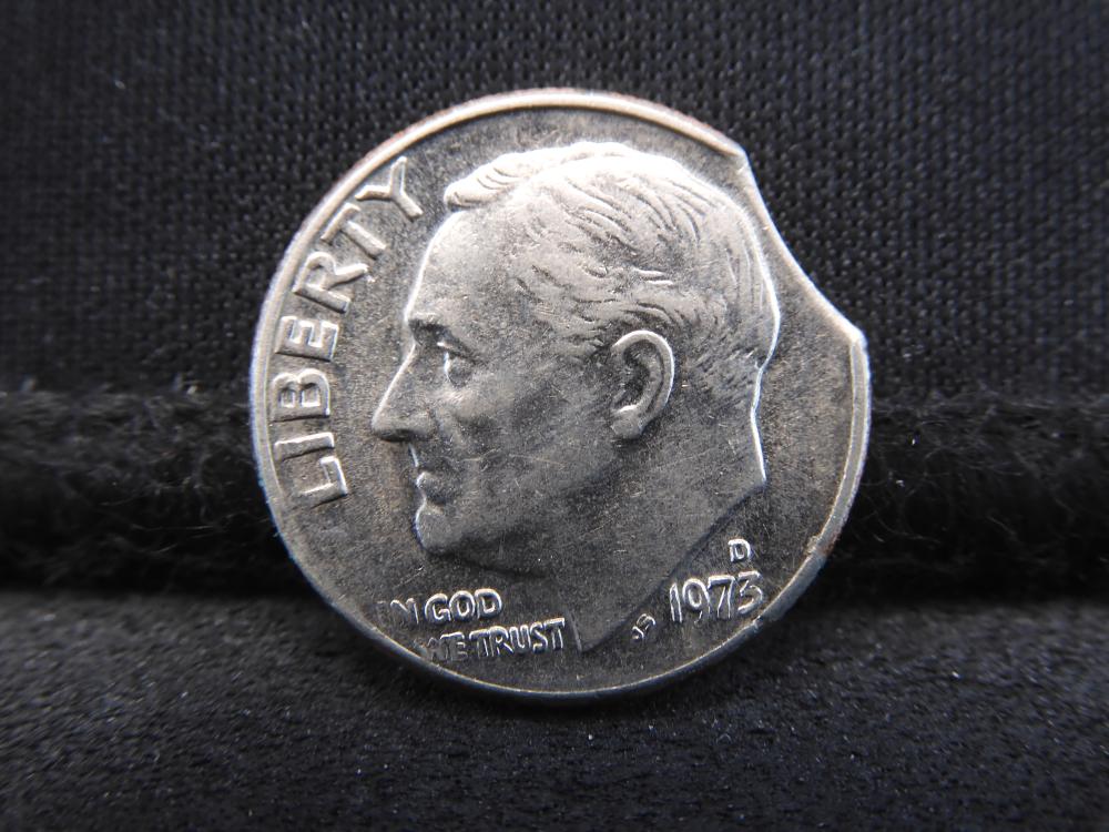 1973 Roosevelt dime clipped planchet error showing curved notch missing from the coin edge